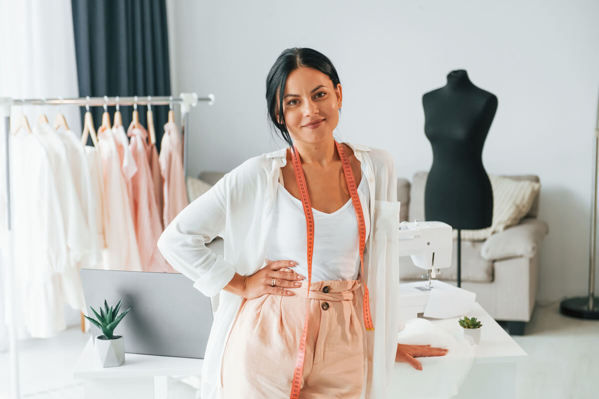 standing-and-posing-seamstress-is-in-her-office-t-9NXCTNG.jpg